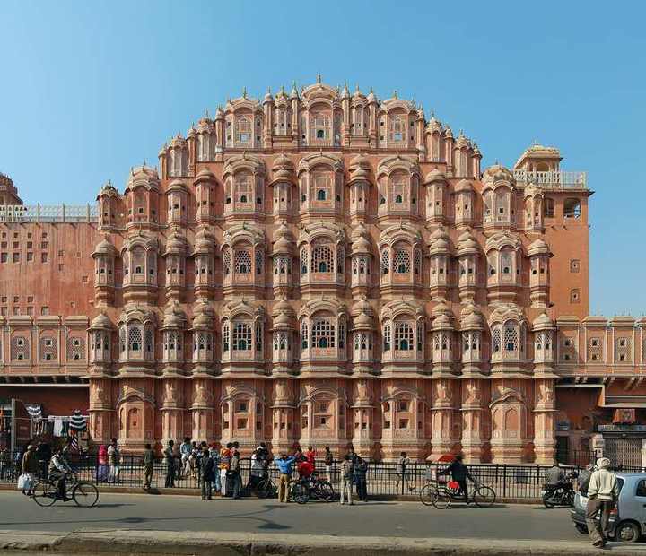 The pink sandstone facade of Hawa Mahal in Jaipur