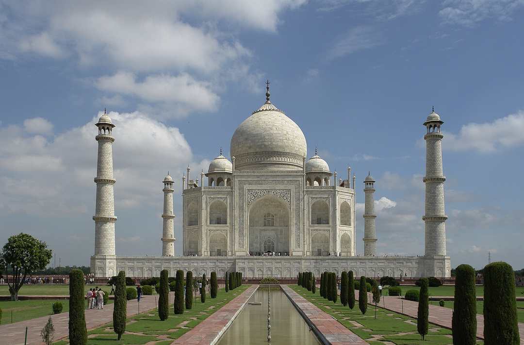 The white marble Taj Mahal and its reflecting pool at Agra