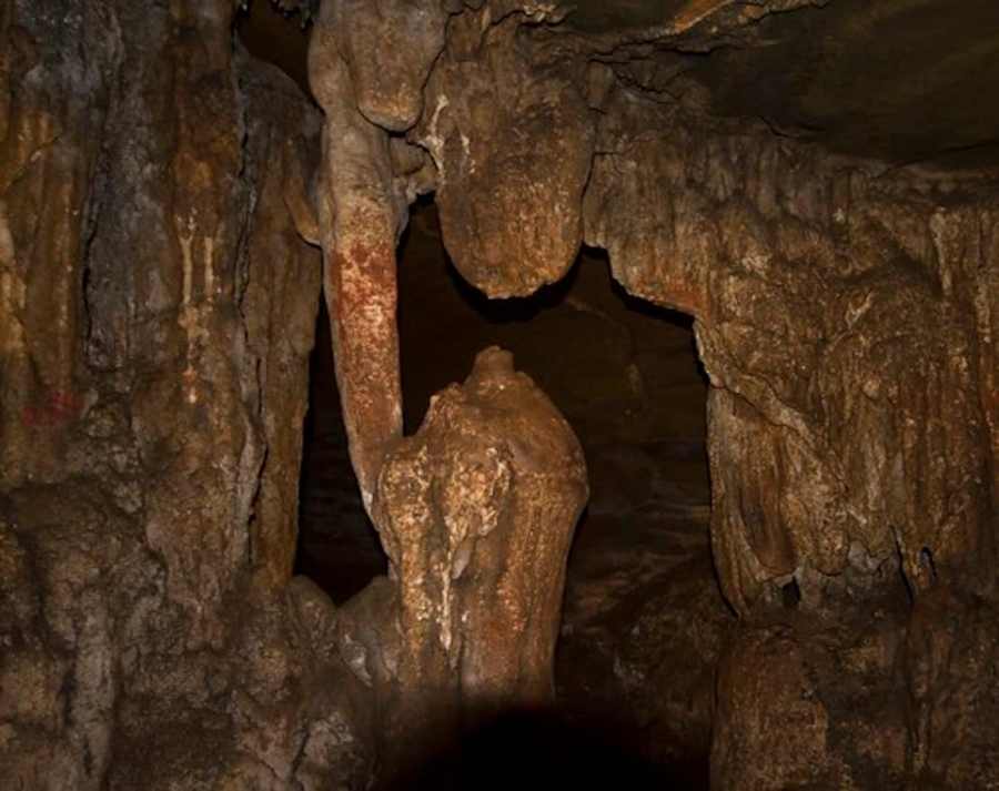 Stalactite and stalagmite formations inside Kailash Cave