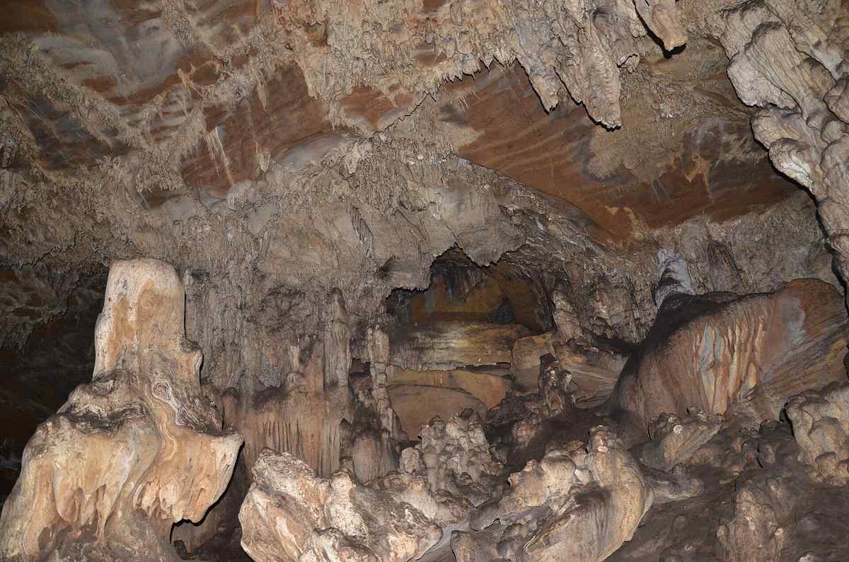 Stalactite and stalagmite formations inside Kotumsar Cave