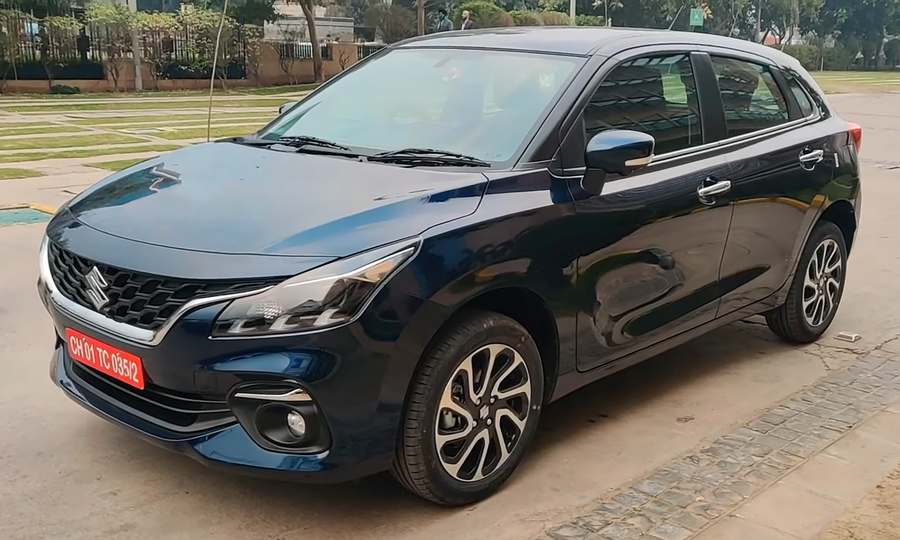 Dark blue Maruti Suzuki Baleno hatchback, front three-quarter view