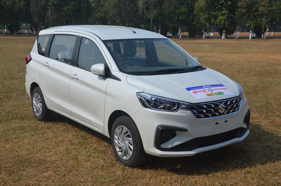 White Maruti Suzuki Ertiga MPV, front three-quarter view